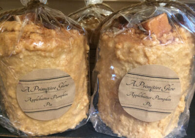 Two off-white grubby candles